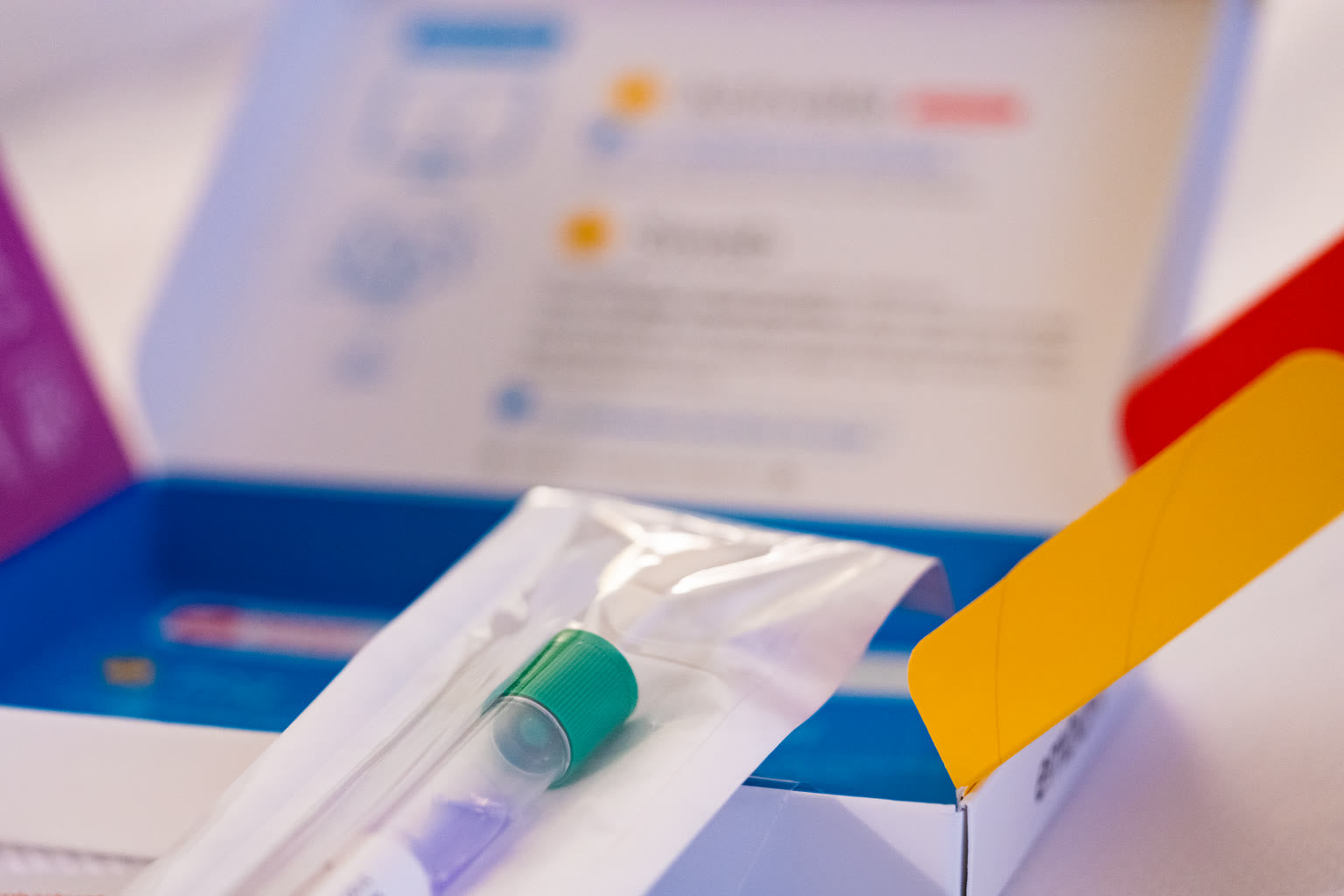 Microbiome test kit beside laptop