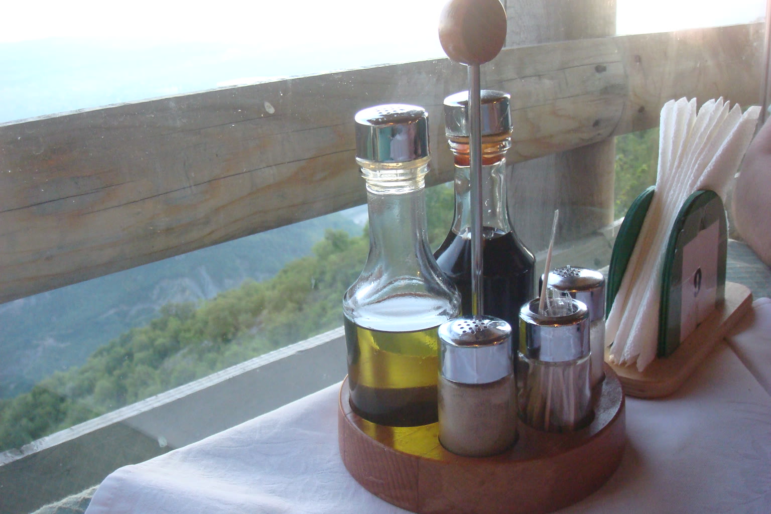 Olive oil cruet and greens
