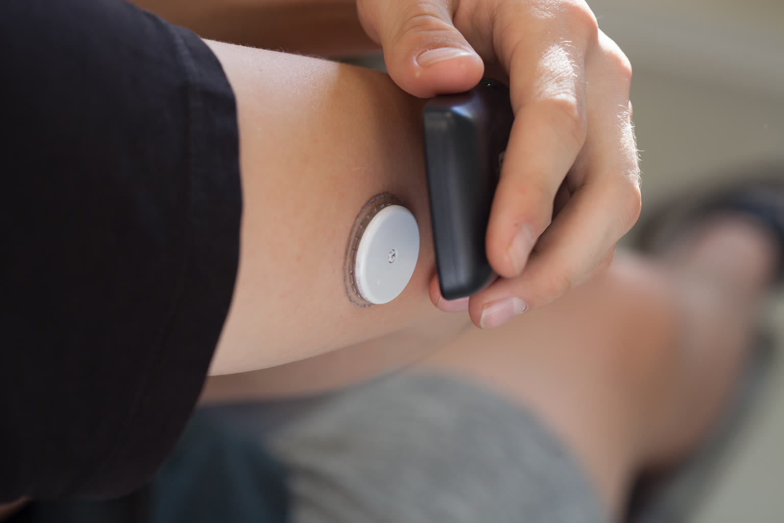 CGM sensor patch on arm