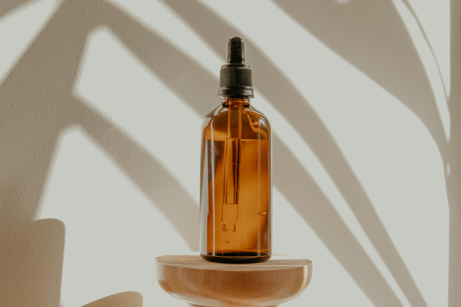 Bitters dropper bottle and water glass