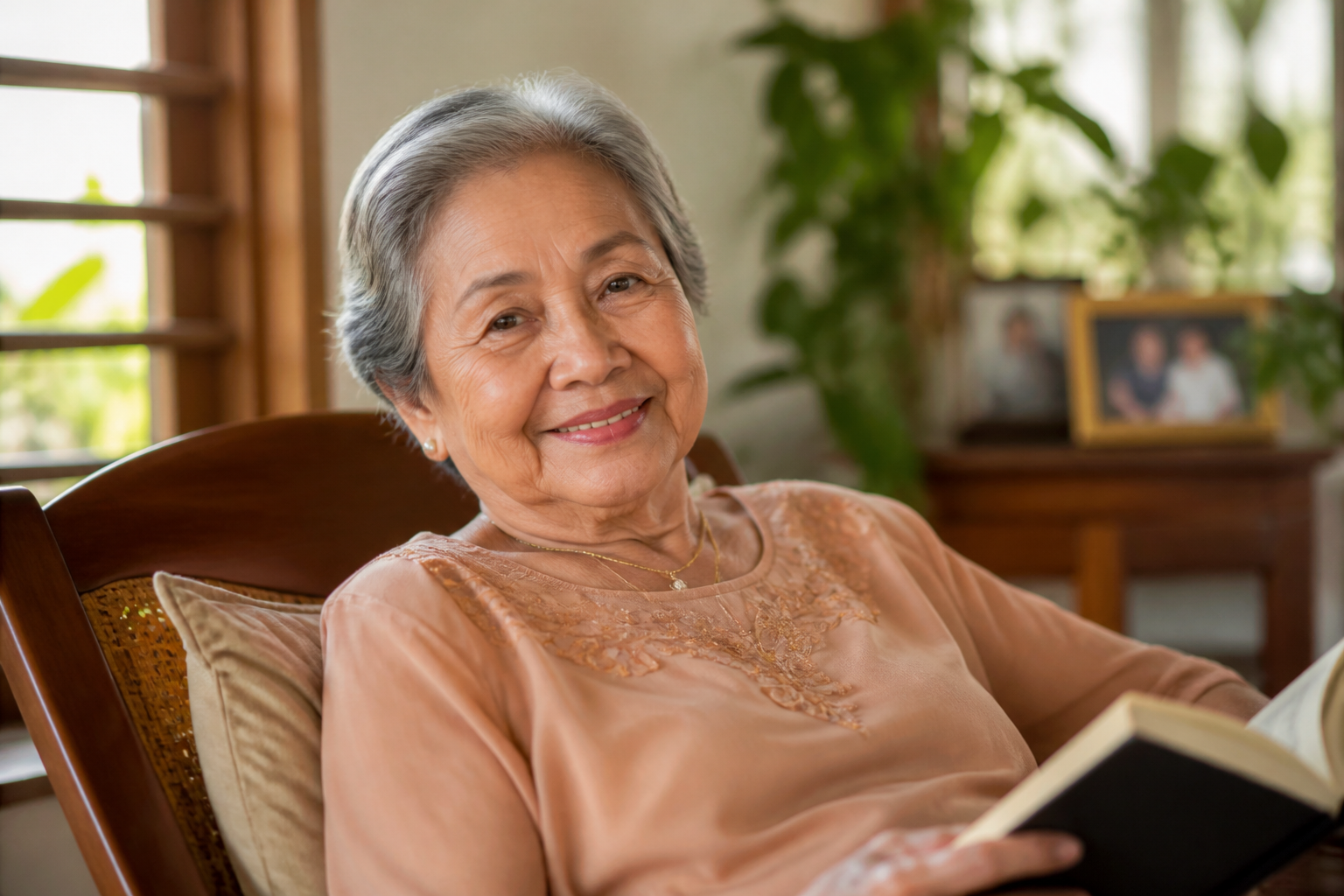 Filipino adult in their 70s in a warm home setting