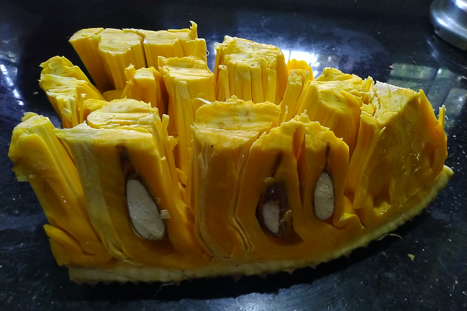 Halved jackfruit on cutting board