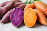 Purple and orange kamote sweet potatoes whole and sliced open
