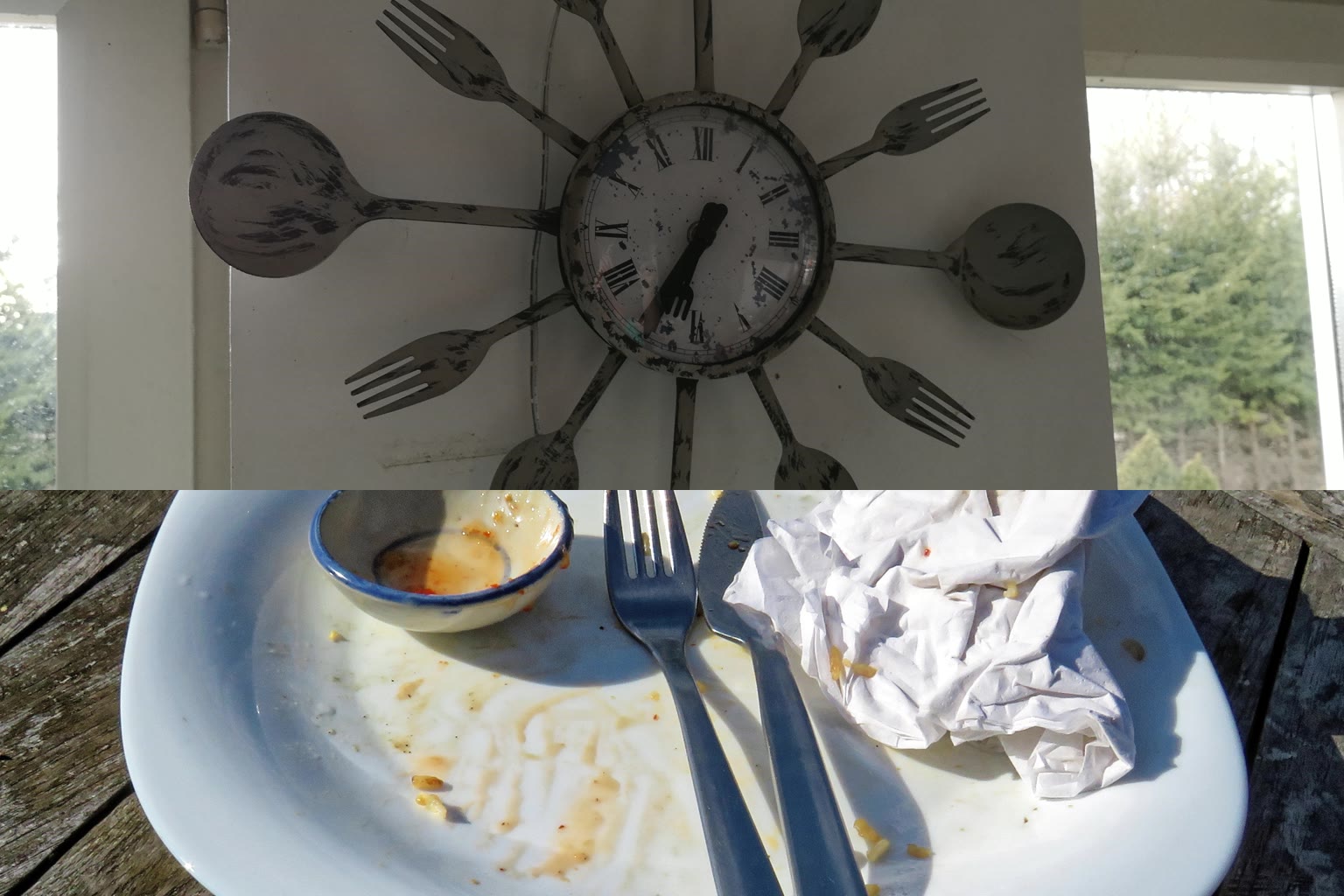 A kitchen clock above a dining table with a finished plate in soft natural light.