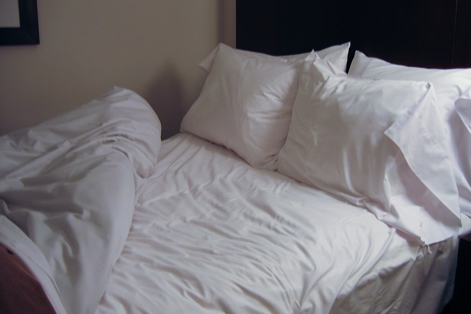 Neatly made bed morning light