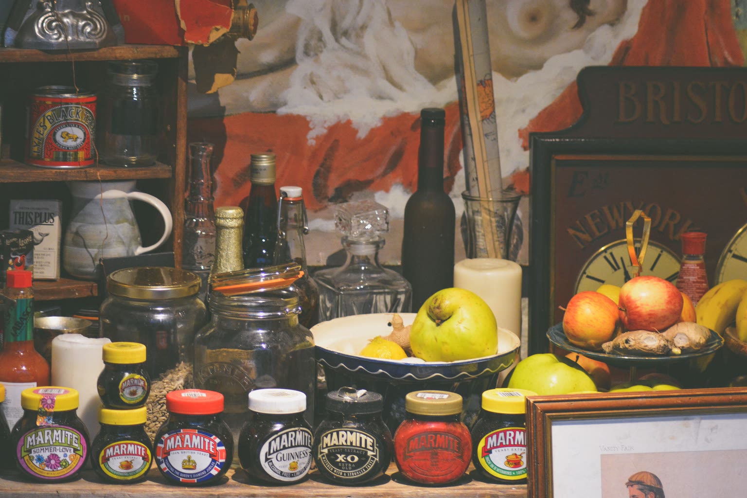Nearly empty pantry shelf with one grain jar